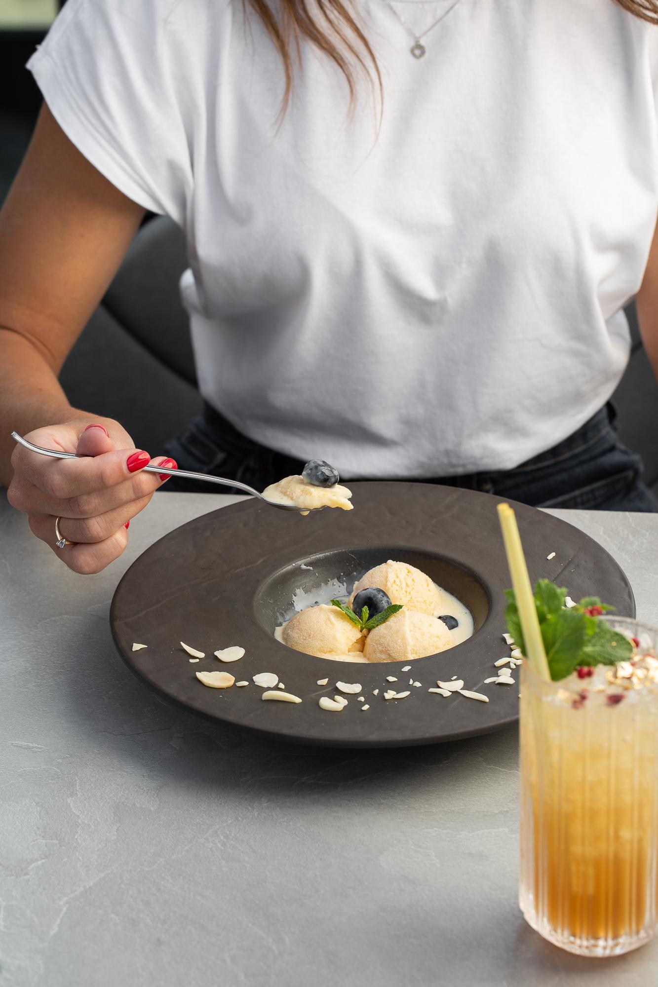 Chef arranging plated dish in calm studio